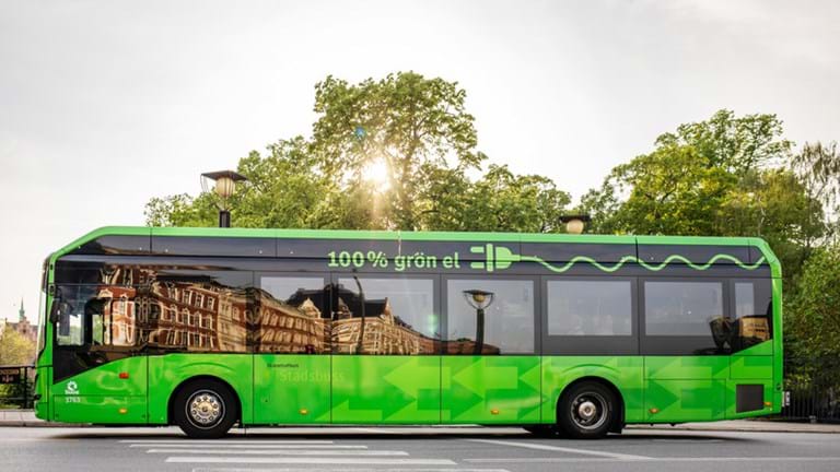 A green electric bus